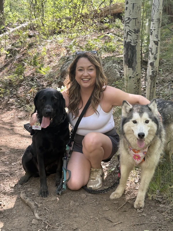 Elena walking with Nala and Noodles